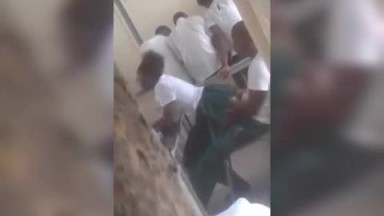Two students secretly chopping in class
