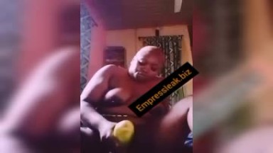 Ghanaian girl fingering with cucumber