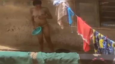 Camera caught on a girl bathing outside